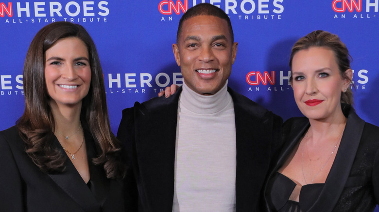 Don Lemon and co-anchors smile at event