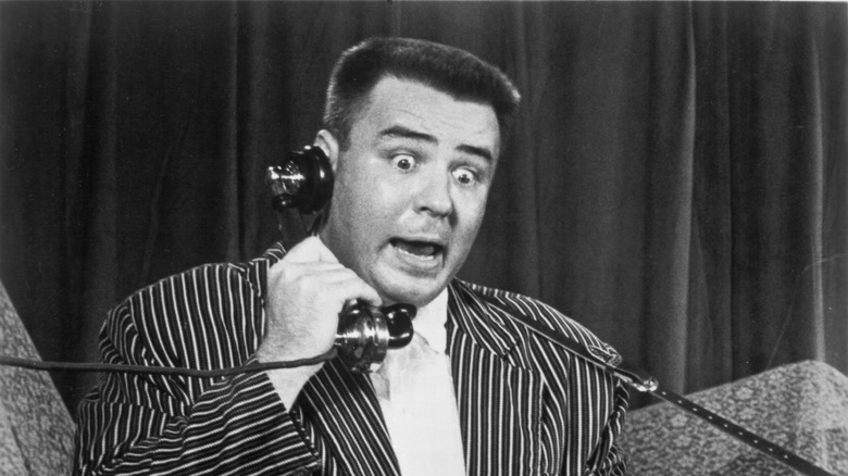 the big bopper holding phone