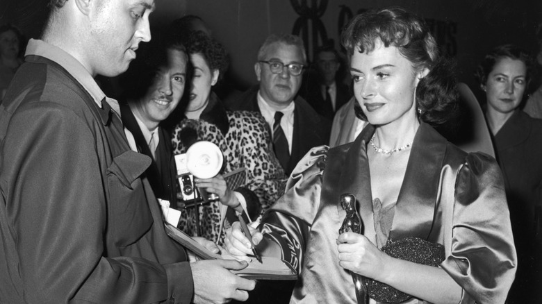 Donna Reed signs an autograph 