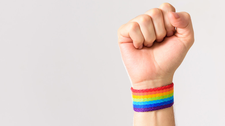 fist homophobia solidarity rainbow