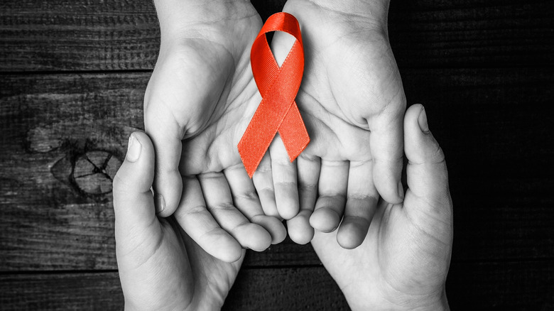 AIDS HIV ribbon hands 