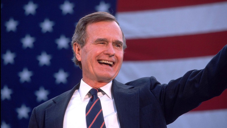 George H.W. Bush waves to a crowd