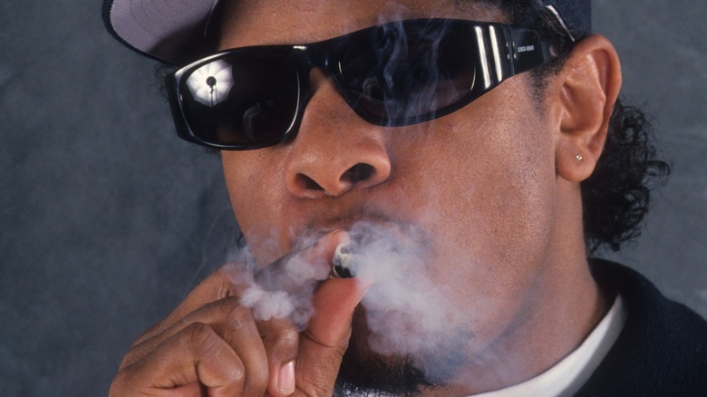 Eazy-E smokes in a portrait