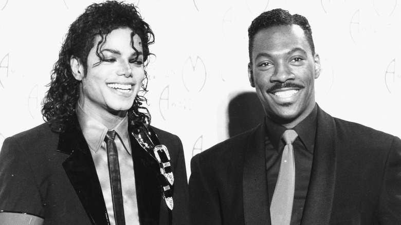 Michael Jackson and Eddie Murphy smiling