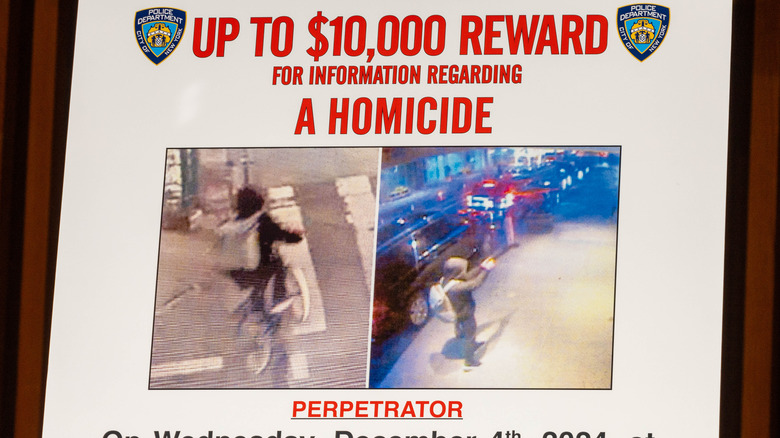 A wanted poster is set up at an NYPD press conference