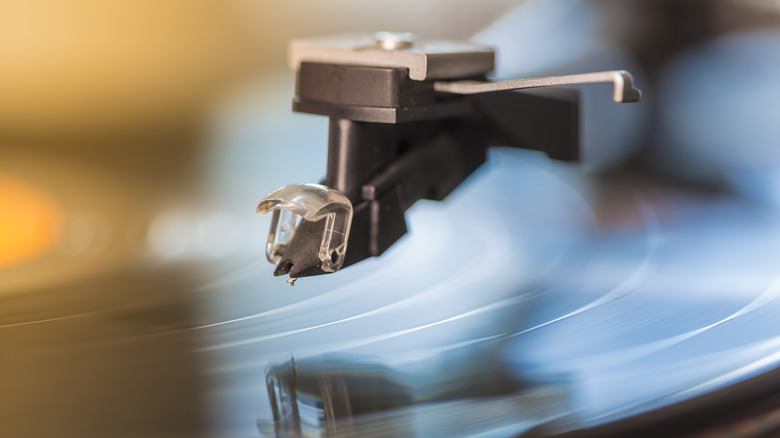 A turntable stylus above a vinyl record