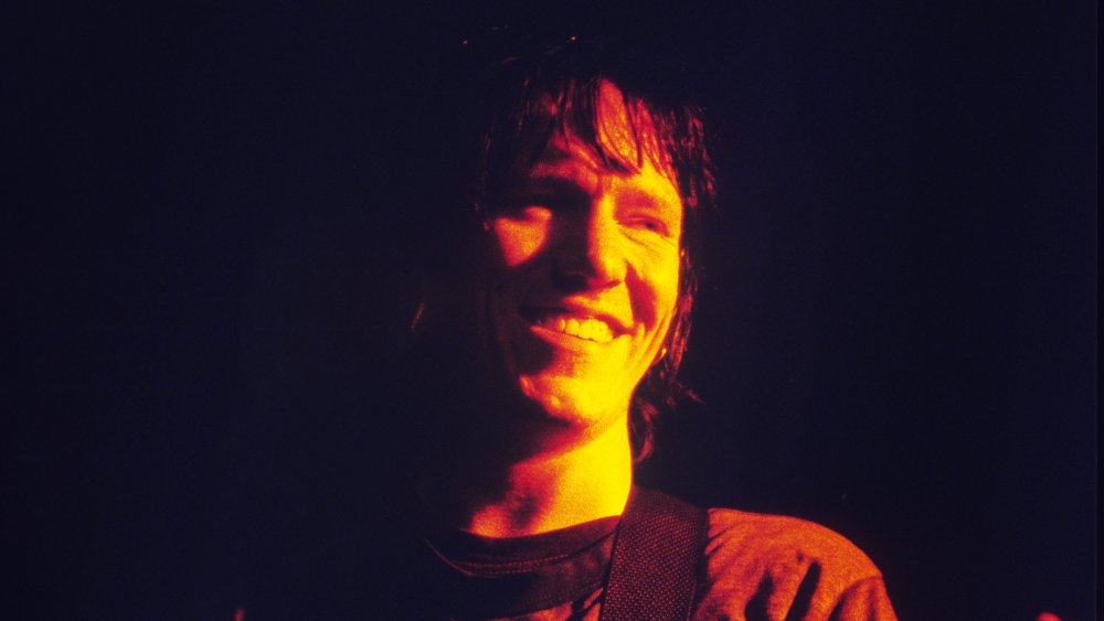 Yet another snap of Elliott Smith and... gracious, smiling?