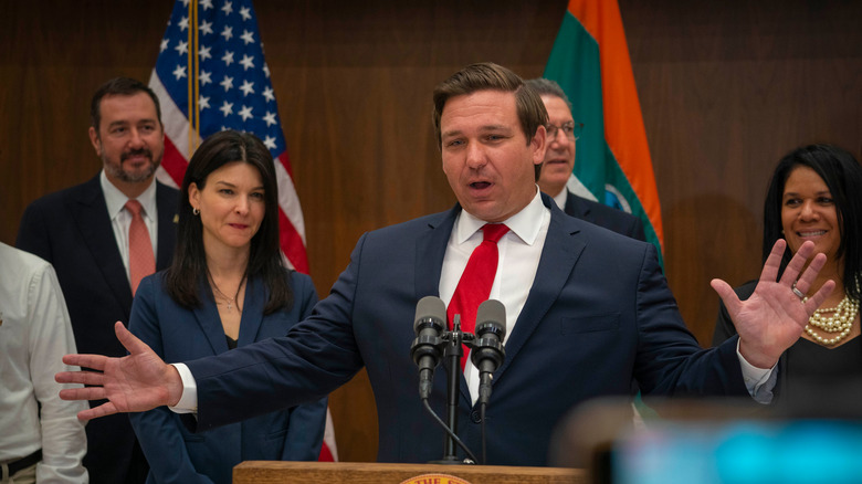 Ron DeSantis in front of microphones