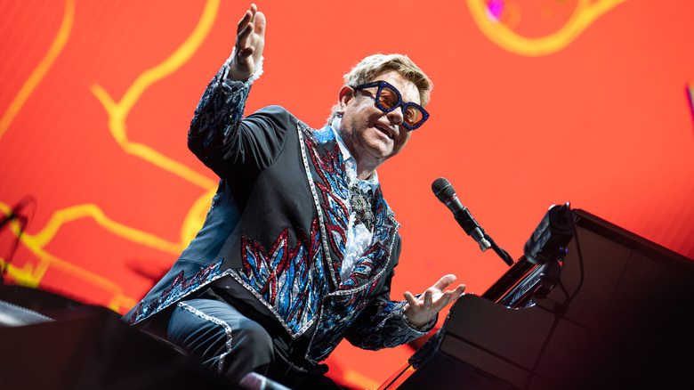 Elton John at piano on stage