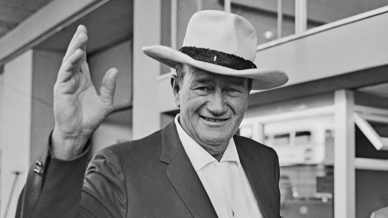 John Wayne waving