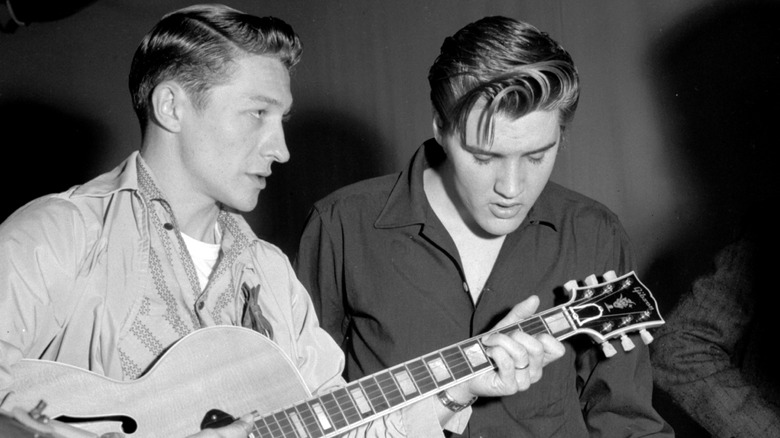 Scotty Moore and Elvis Presley