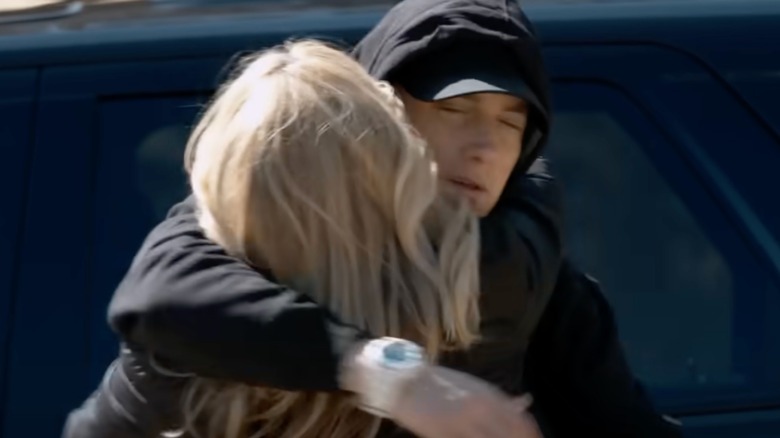 eminem hugs lookalike of his mother in video for "headlights"