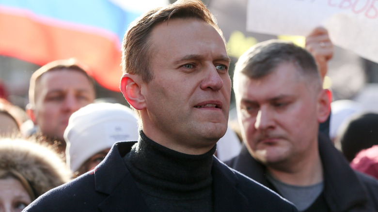 Alexei Navalny outside in a crowd of people