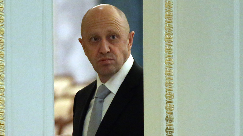 Yevgeny Prigozhin stepping through a door