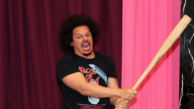 eric andre swinging baseball bat yelling by pink curtains