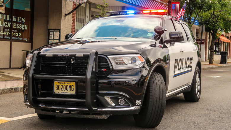 New Jersey police car in street with lights flashing