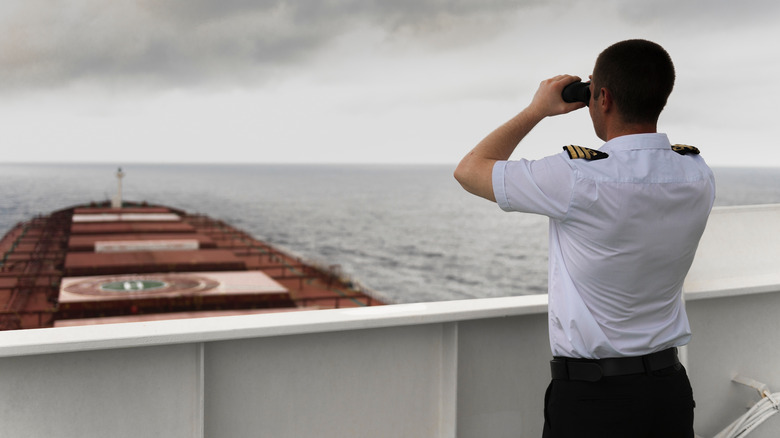 Man looking out to see from ship