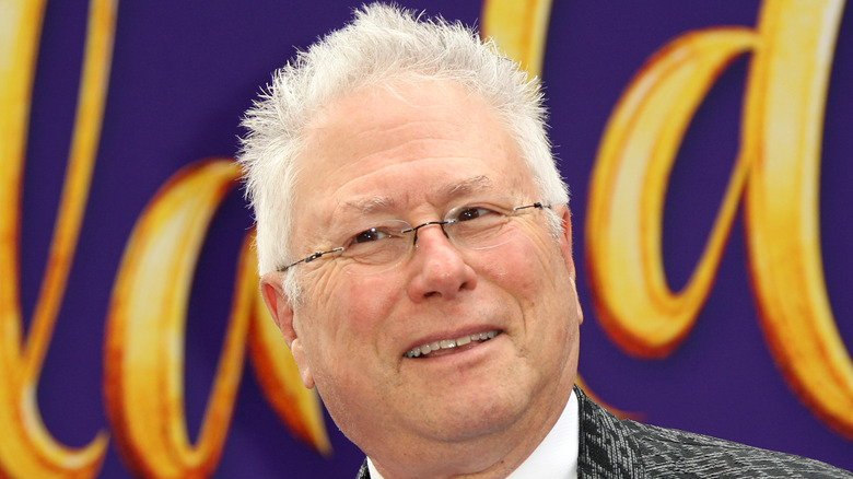 Alan Menken posing on a red carpet