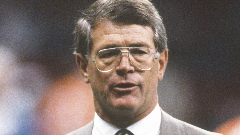 Dan Reeves wearing suit during game