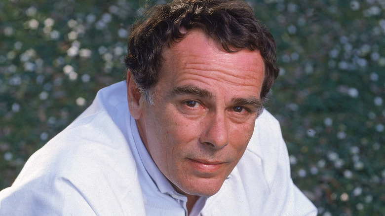 Dean Stockwell serious in white jacket