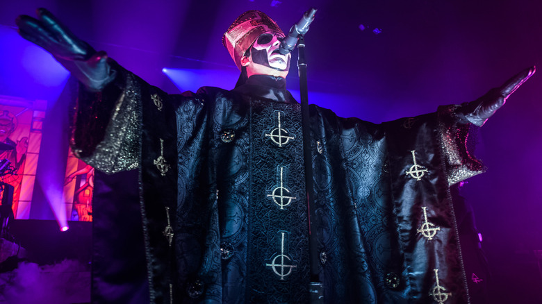 Papa Emeritus III hands out