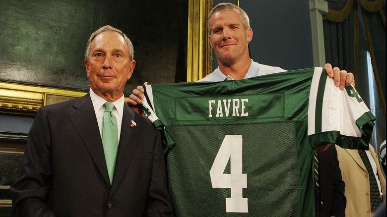 Brett Favre holding Jets jersey