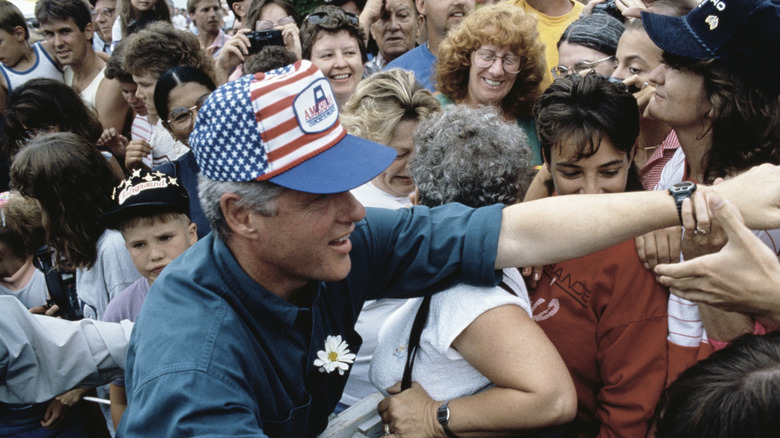 Bill Clinton wading through crowd