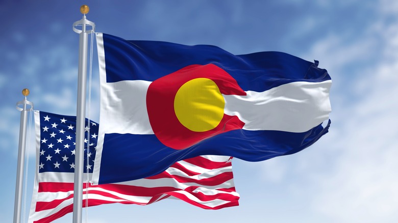 Colorado flag, American flag waving