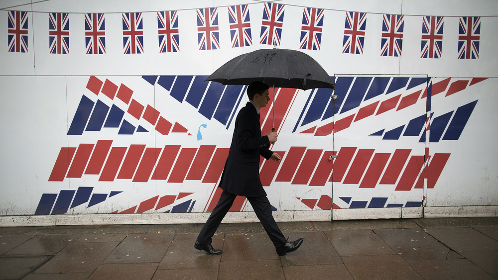 Man carrying an umbrella in the rain 