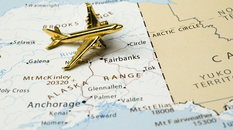 map of Alaska with a toy plane