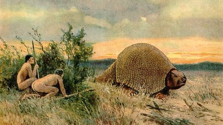 Painting of humans hunting Glyptodon