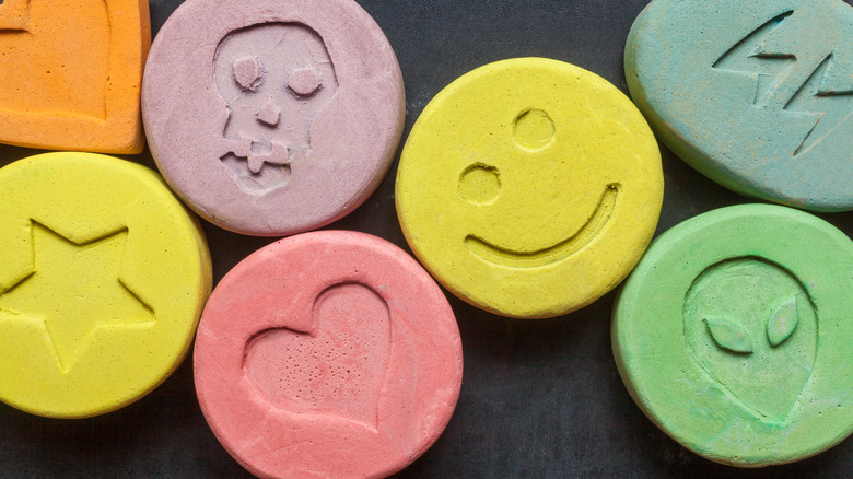 colorful stamped tablets on a black background