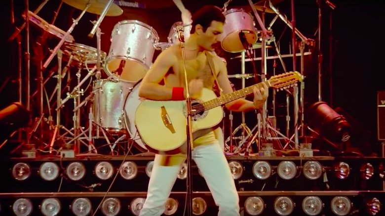 Freddie Mercury playing guitar