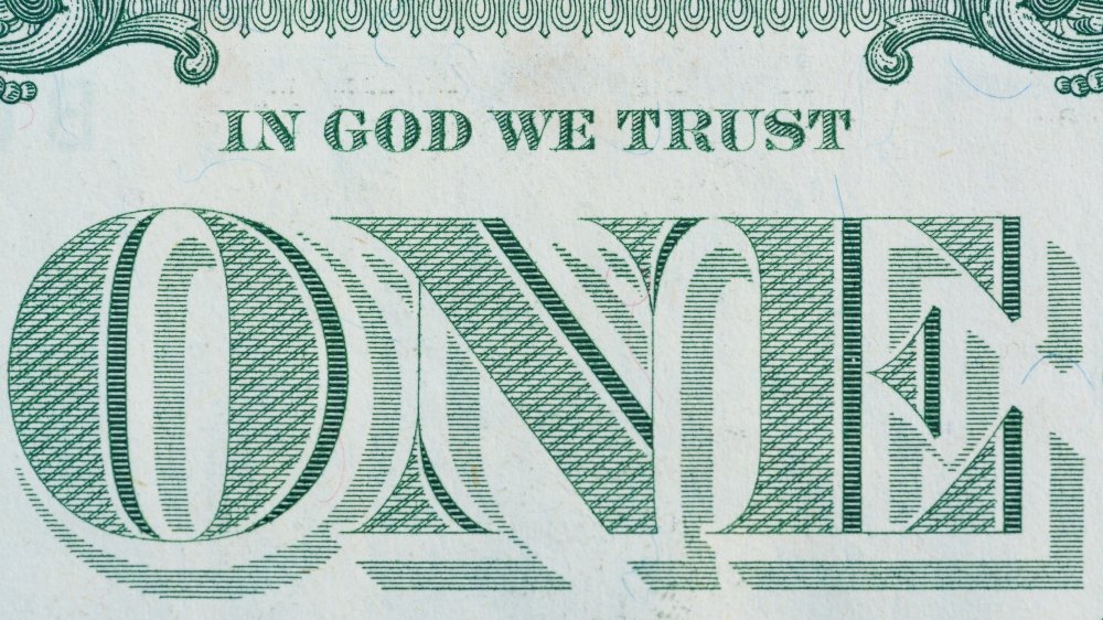 National motto on one-dollar bill.