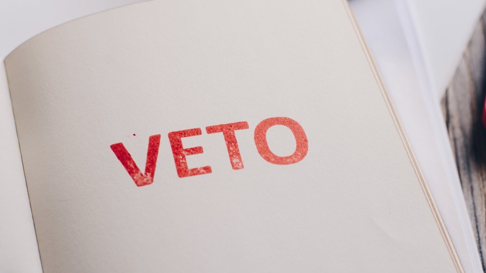 Paper with the word VETO printed on it.