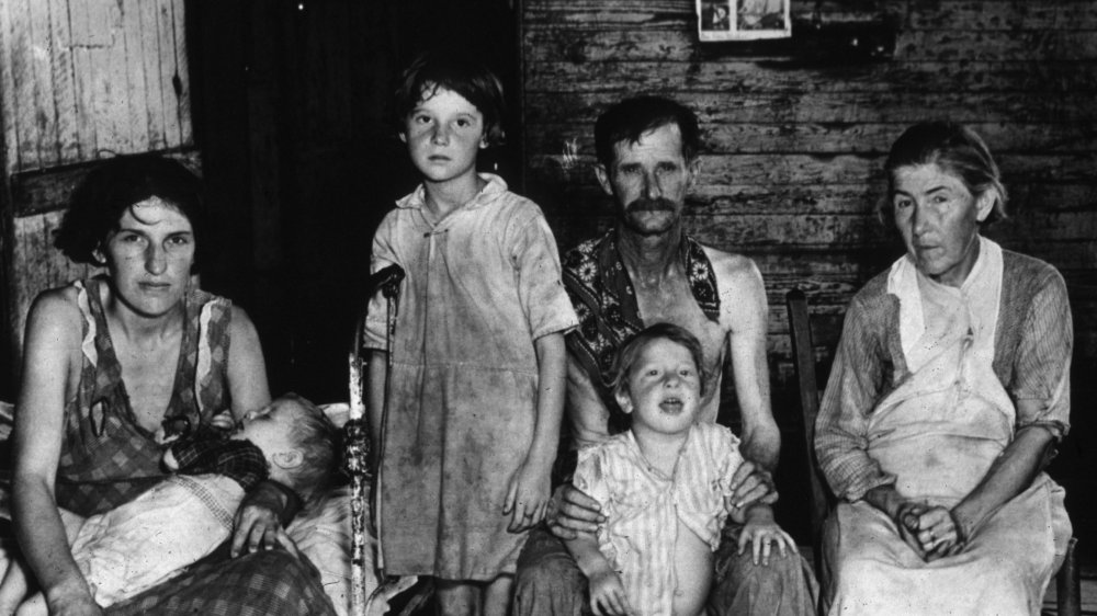 Unemployed sharecropper and family