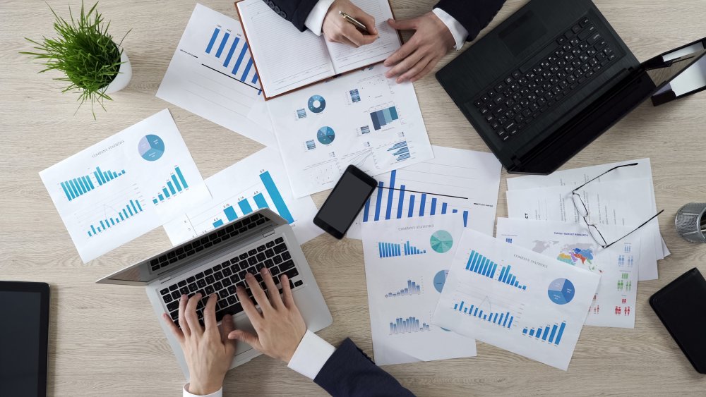 A table full of polling graphs, charts, and statistics