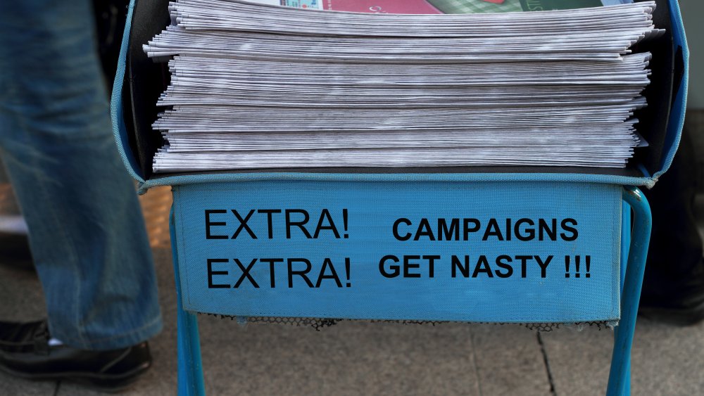 "Campaigns get nasty" stack of newspapers