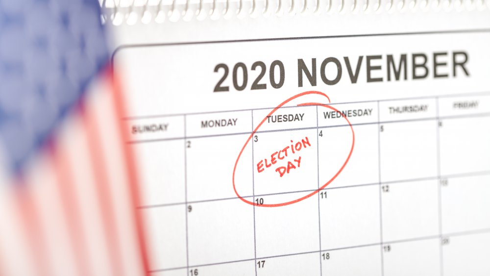 2020 calendar with November 3rd circled next to an American flag