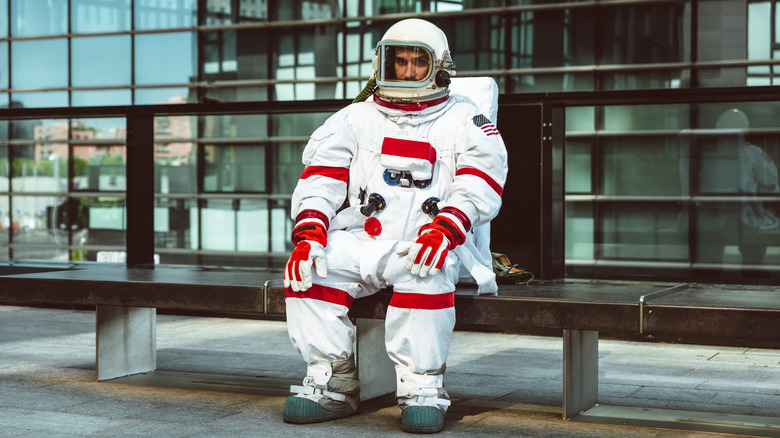 Astronaut at a bus stop