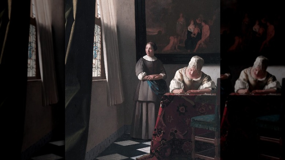 Lady Writing a Letter with her Maid by Johannes Vermeer