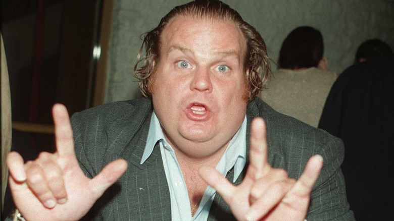 Chris Farley making hand gestures at a peremire