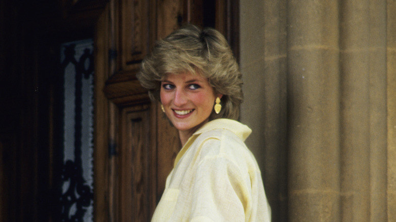 Princess Diana smiling over her shoulder