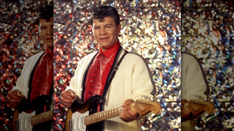 Ritchie Valens holding a guitar