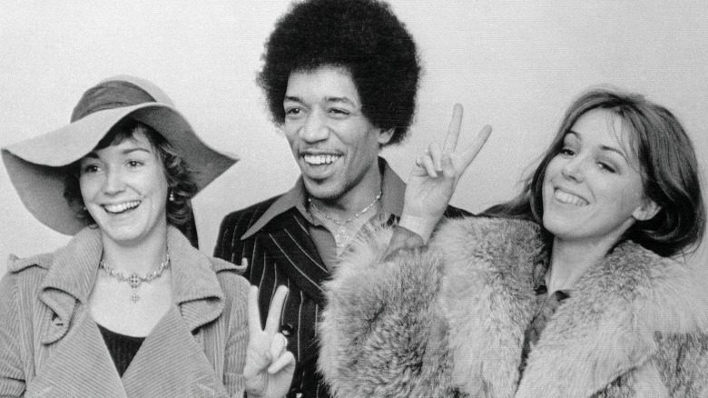 Hendrix and female friends smiling