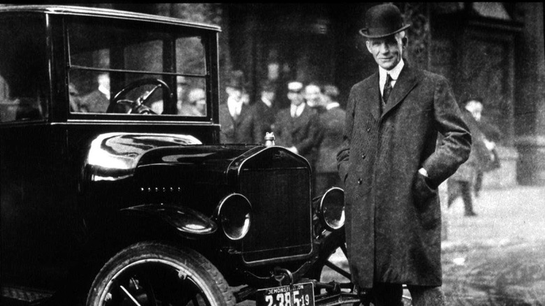 Henry Ford next to Model T