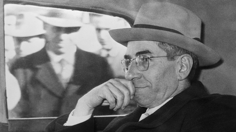 Lucky Luciano in car hat glasses