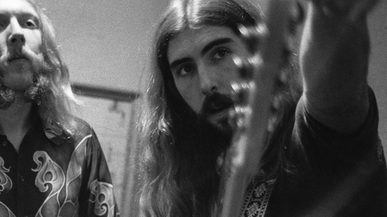 Berry Oakley tuning guitar