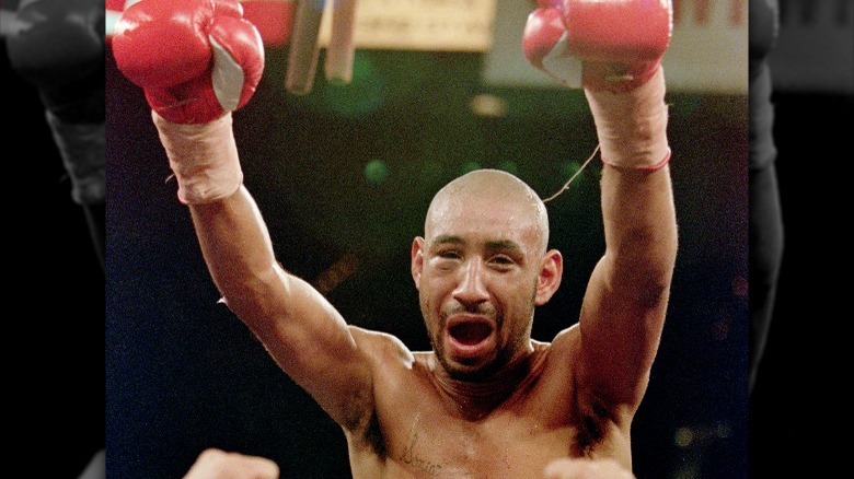 Corrales in ring raising hands