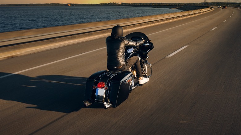 Man riding motorcycle on highway